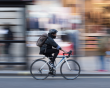 Cyclist riding through a busy London street
