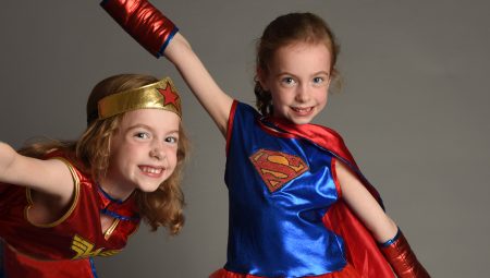 Two young girls, Ciara and Aoife, dressed as superheros