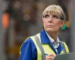 Middle aged woman at work wearing a hi-vis jacket