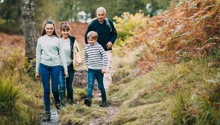 Parents and children walking in the woods