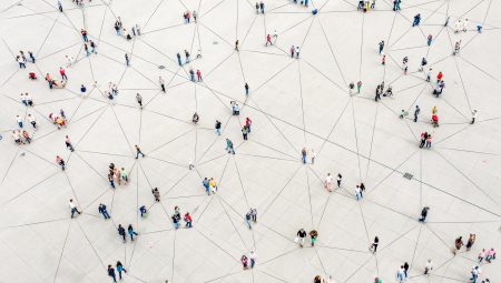 bird's eye view of people walking through an empty space. Every person is connected to another with a grey line.