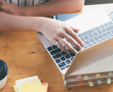 overhead view of a women working on her laptop