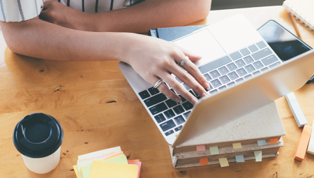 overhead view of a women working on her laptop