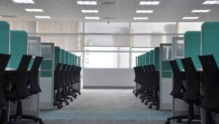 Empty open plan office desks and chairs.
