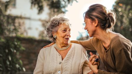 Older woman talks to her middle aged daughter