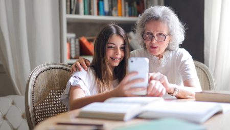 Grandmother takes selfie with her granddaughter