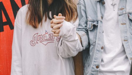 Young people holding hands